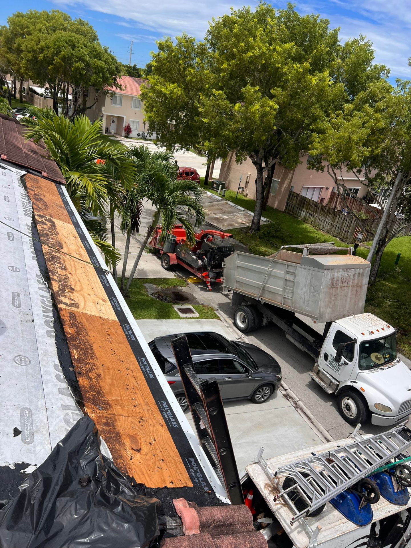Job site prepared with protection before a roof installation on a Miami property