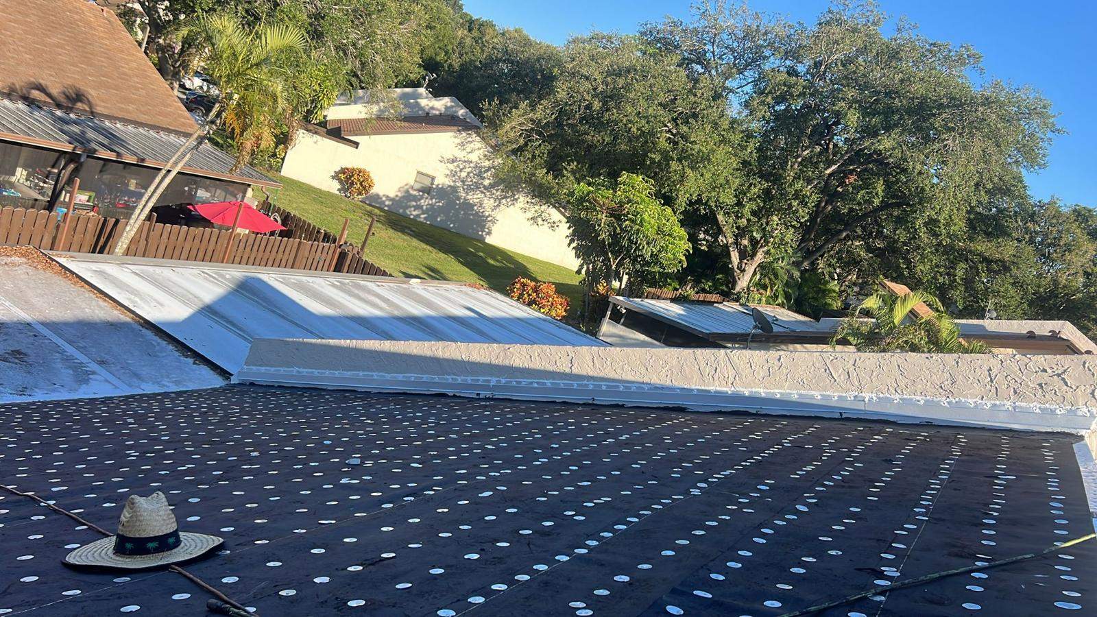Inspector documenting roof condition for an insurance report in Miami